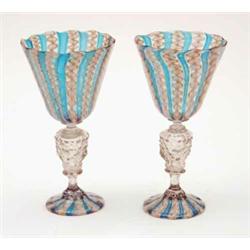 A pair of late 19th century Venetian goblets, in blue, white and aventurine, on clear glass stems...