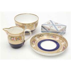 A Sevres porcelain trinket box and cover, painted with flowers, 2.75ins and a Victorian bone chin...
