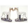 Image 1 : A pair of Victorian Staffordshire dogs, white with black spots, each holding rabbit in mouth, on...