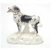 Image 1 : A Victorian Staffordshire earthenware model of a dog, with black-painted markings, standing 4-squ...
