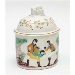 An early 19th century Prattware oval tobacco box and cover moulded in relief to one side with car...