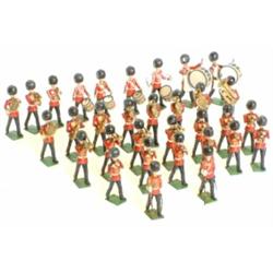 Britains Irish Guards bandsmen, post- war, thirty two piece mixed band including two bass drummer...