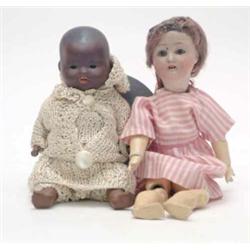 An Armand Marseille mullato "My Dream Baby" doll, mould 351, bisque head with sleeping eyes, join...