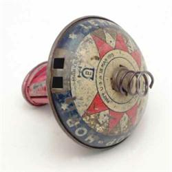 A Lehmann "Hop Hop" spinning top, lithographed tinplate with clockwork motor- some wear...