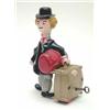 Image 1 : A plastic clock work figure of a gent carrying luggage 6.25ins...