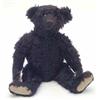Image 1 : A rare Steiff black plush teddy bear, circa 1915, boot button eyes with characteristic red felt s...