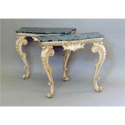 A pair of 19th century Italian gilt and grey painted wood console tables each with a later shaped...