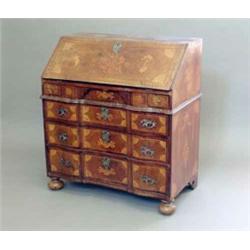 A 19th century Dutch walnut and marquetry bureau, inlaid with flowers, batswings and paterae, the...
