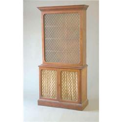 An early 19th century mahogany bookcase with moulded and Greek key cornice, large single glazed d...