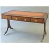 Image 1 : A late 18th century chestnut double sided library table with tan skiver over opposing drawers on...