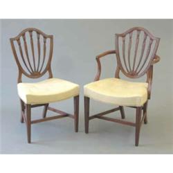 A fine set of 12 Hepplewhite period mahogany shield back dining chairs (including two with arms),...