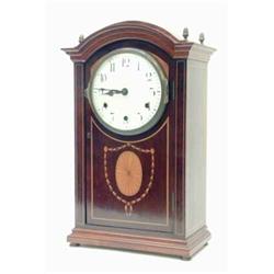 An Edwardian mahogany chiming bracket clock, the tall rectangular case with domed top inlaid with...