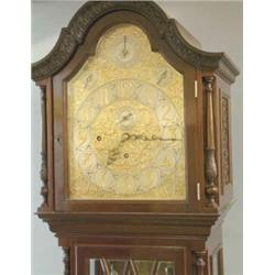 An Edwardian mahogany 8-day chiming longcase clock, the arched silvered dial with gilt fretwork,...