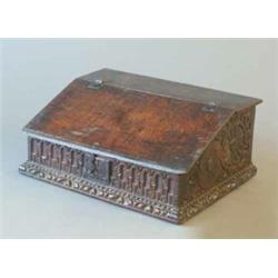 An English 17th century oak bible box with later carved decoration, 2ft....
