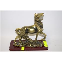 GOLD TONE HORSE FIGURING ON WOODEN STAND