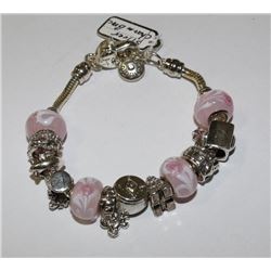SILVER CHARM BRACELET WITH PINK STONES