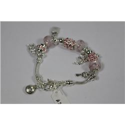 SILVER CHARMS BRACELET W/ PINK STONES
