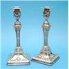 Image 1 : A pair of Adam design plated candlesticks, with rams head capped columns and swept square bases,...