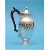 Image 1 : An Edwardian silver hot water pot, with spiral fluting and ebonised handle, 1905, Gross 12oz....