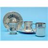 Image 1 : A pair of French silver coffee cups and saucers, with foliate strapwork decoration, and a WMF pla...