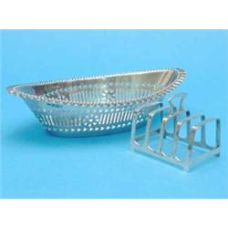 An Edwardian pierced silver bowl, of elliptical form, 8 ins, and a small toastrack....