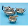 Image 1 : An Edwardian silver three piece tea set, of oval form with scroll feet, Birmingham 1905, Gross 38...