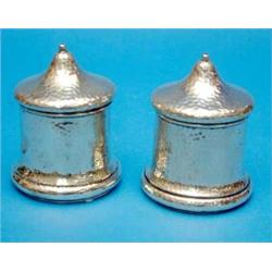 A pair of Edwardian hammered silver string boxes....