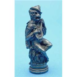 A 19th century German silver sealing wax case, modelled as a monkey, playing a mandolin, 2.75 ins...