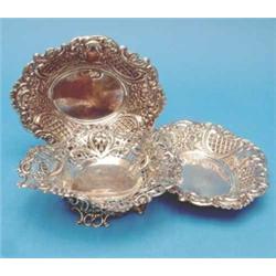 A pair of small silver bonbon dishes and a pierced dish....