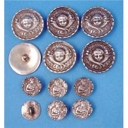 A set of 6 Edwardian silver buttons, decorated with lyre players, and a similar set of unmarked c...