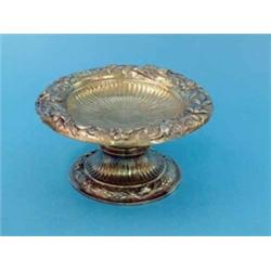 A George II silver gilt pedestal bowl, with later 17th century style embossed and chased decorati...