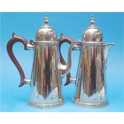 A pair of Georgian design silver cafe au lait pots, with wooden scroll handles, Birmingham 1962,...