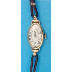 A ladys 18ct gold wristwatch with oval Arabic dial....