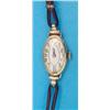 Image 1 : A ladys 18ct gold wristwatch with oval Arabic dial....