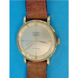 A gentlemans 18ct gold Universal Polerouter Deluxe wrist watch with baton numerals and centre sec...