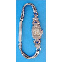 A ladys diamond set platinum cocktail watch with 9ct white gold snakelink bracelet....