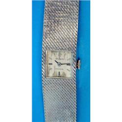 A ladys 18ct white gold Rolex Precision wrist watch with integral flexible bracelet and square di...
