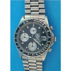 A Gentleman's steel TAG Heuer 2000 quartz chronograph wristwatch with black dial....