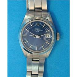 A ladys steel Rolex Oyster Perpetual Date wrist watch, with blue dial and baton numerals, in gree...