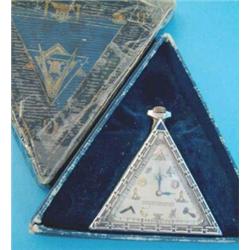 A Swiss silver Masonic pocket watch, of triangular form with mother of pearl dial decorated with...