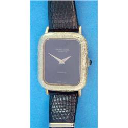 A ladys 18ct gold Favre-Leuba wrist watch with textured case, black dial and quartz movement....