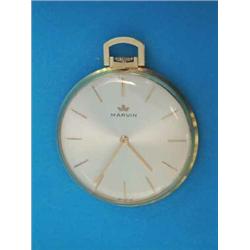 An 18ct gold Marvin dress watch with champagne dial and baton numerals....