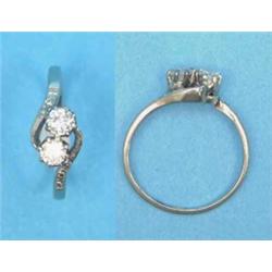 An 18ct white gold and platinum 2-stone diamond crossover ring, with diamond set shoulders...