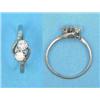 Image 1 : An 18ct white gold and platinum 2-stone diamond crossover ring, with diamond set shoulders...