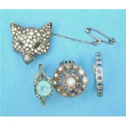 A Sterling silver foxhead brooch, pave set clear and green pastes, two 9ct gold dress rings and a...