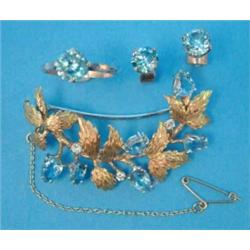 An 18ct gold leaf brooch, set 6 pear shape aquamarines and 3 round cut diamonds, together with a...