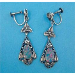 A pair of Arts & Crafts design silver drop earrings, each set with a pear shape synthetic opal....