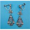 Image 1 : A pair of Arts & Crafts design silver drop earrings, each set with a pear shape synthetic opal....