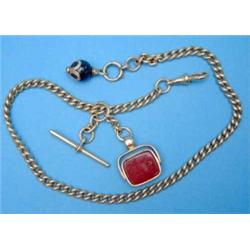 An 18ct gold curblink albert, with gold mounted cornelian swivel fob seal, gross weight 63.0grms...