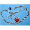 Image 1 : An 18ct gold curblink albert, with gold mounted cornelian swivel fob seal, gross weight 63.0grms...